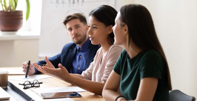 3 peers sitting together working